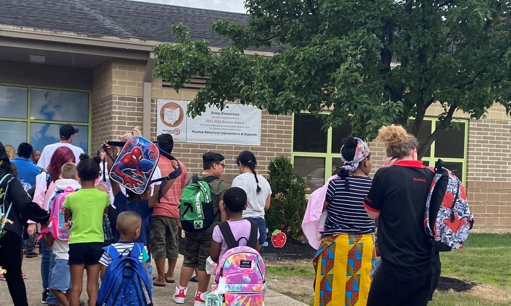 Kids and parents lined up before the first day of school started at Kemp Elementary, part of Dayton Public Schools, on Monday, Aug. 14, 2023. Eileen McClory / Staff