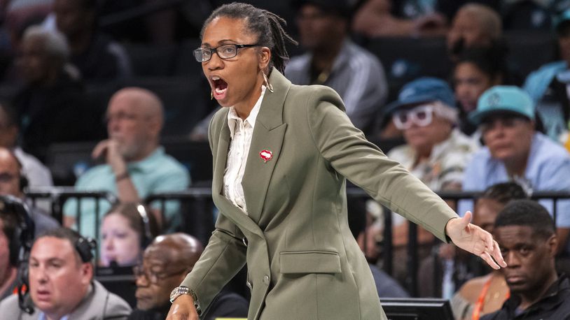 Atlanta Dream head coach Tanisha Wright reacts during the first half of a WNBA basketball first-round playoff game against the New York Liberty, Sunday, Sept. 22, 2024, in New York. (AP Photo/Corey Sipkin)