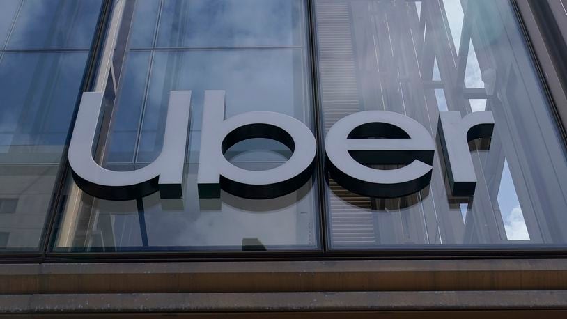 FILE - An Uber sign is displayed at the company's headquarters in San Francisco, Sept. 12, 2022. (AP Photo/Jeff Chiu, File)