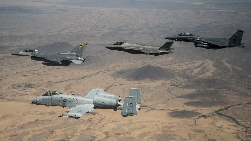 Col. Kurt Gallegos, the 944th Fighter Wing commander, leads a four-ship formation with the A-10 Thunderbolt II, F-35 Joint Strike Fighter and F-15 Strike Eagle, during his fini-flight near Luke Air Force Base, Ariz., June 2, 2017.  (U.S. Air Force photo by Tech. Sgt. Larry E. Reid Jr.)