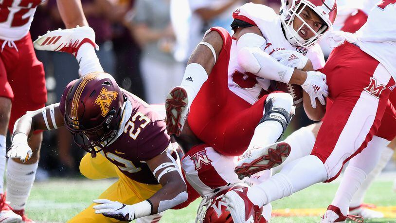 Jordan Howden #23 of the Minnesota Golden Gophers tackles Maurice Thomas #31 of the Miami RedHawks on the opening kickoff return of the game on September 15, 2018 at TCF Bank Stadium in Minneapolis, Minnesota. (Photo by Hannah Foslien/Getty Images)