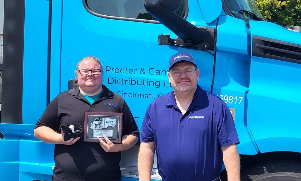 Tilton (L) receiving a 2024 Driver of the Month award from CPC Logistics in April. She is shown with her operations manager, Bill Kinman.