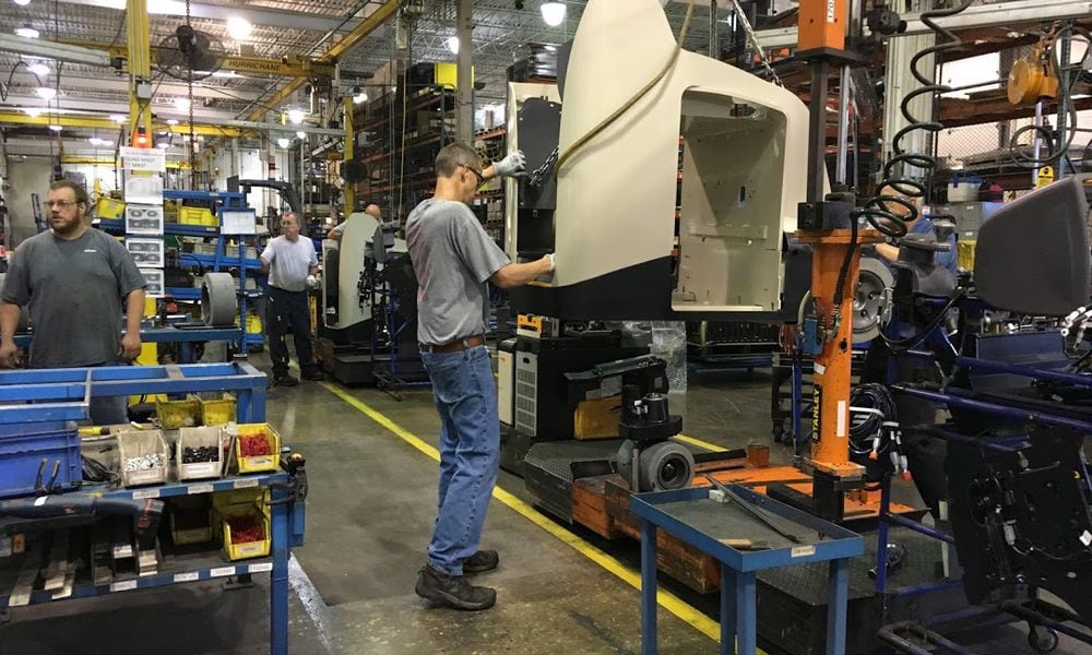 A worker at one of Crown Equipment's New Bremen, Ohio manufacturing floors. THOMAS GNAU/STAFF