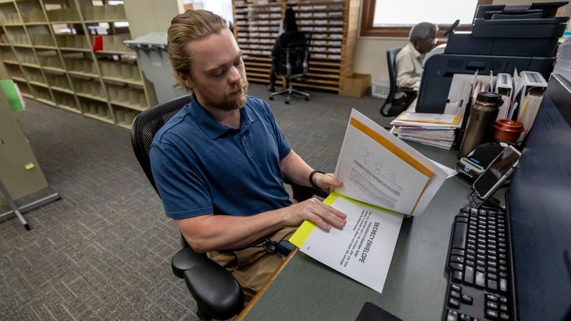 Trey Forrest, Absentee Election Coordinator for the Jefferson County/Birmingham (Ala) Division, prepares absentee ballots for the November election, Tuesday, Sept. 10, 2024, in Birmingham, Ala. (AP Photo/Vasha Hunt)