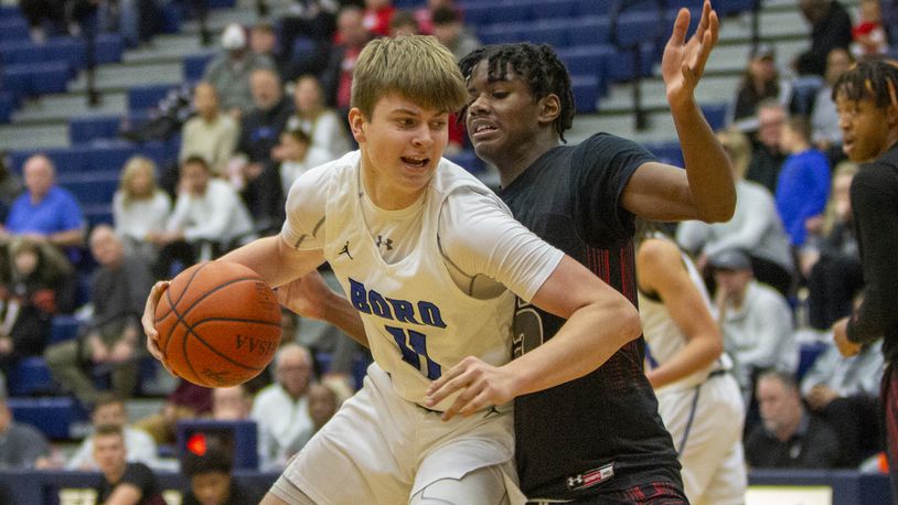 Springboro's Matt Meek battles in the post against Lima Senior's Isaiah Wilson on Monday during Flyin' To The Hoop at Trent Arena. CONTRIBUTED/Jeff Gilbert