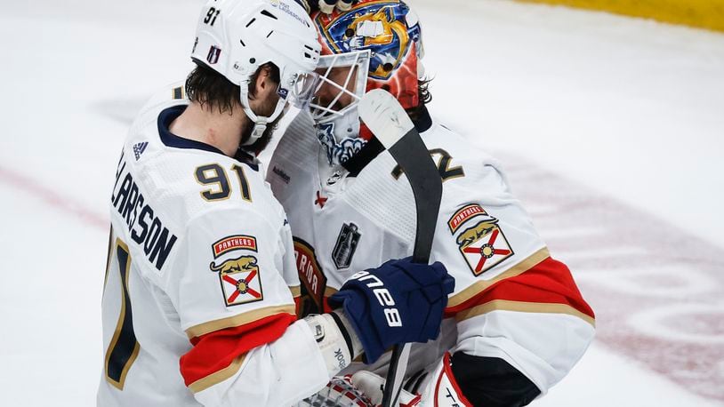 Florida Panthers' Oliver Ekman-Larsson (91) and goalie Sergei Bobrovsky (72) celebrate after defeating the Edmonton Oilers in Game 3 of the NHL hockey Stanley Cup Finals, Wednesday, June 13, 2024, in Edmonton, Alberta (Jeff McIntosh/The Canadian Press)