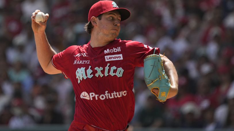 FILE - Diablos Rojos' pitcher Trevor Bauer throws against New York Yankees' Anthony Volpe during the first inning of a baseball exhibition game at Alfredo Harp Helu Stadium in Mexico City, Sunday, March 24, 2024. (AP Photo/Fernando Llano, File)