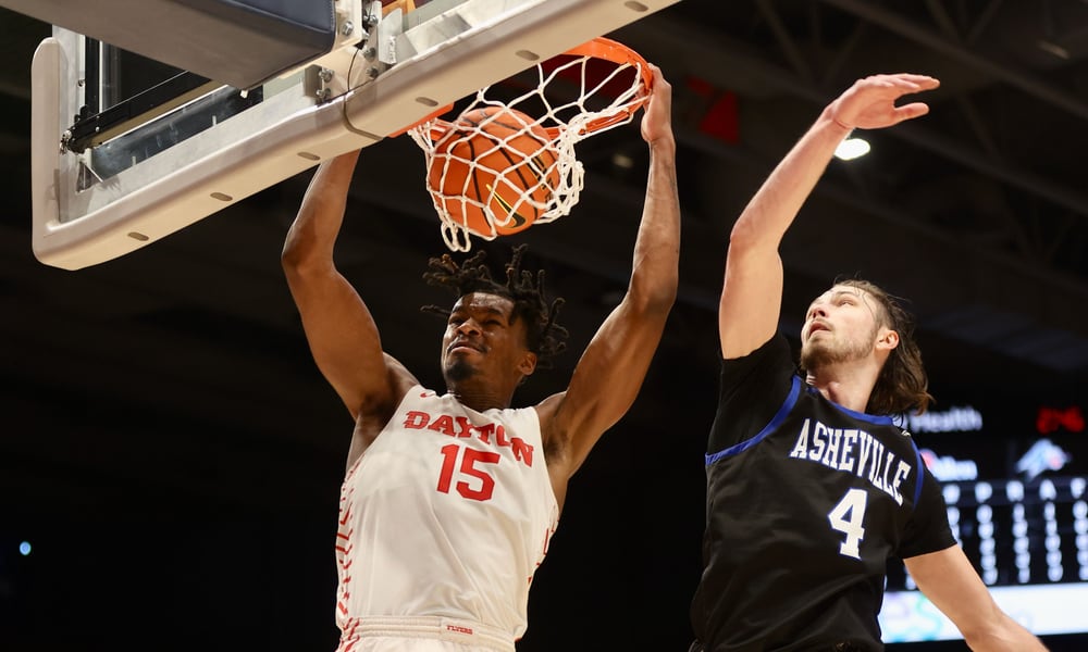 Dayton's DaRon Holmes II dunks against UNC Asheville in the first half on Saturday, Dec. 10, 2022, at UD Arena. David Jablonski/Staff