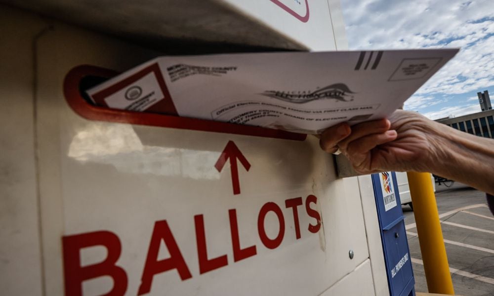 In this file photo from 2023 a Montgomery County voter drops off her ballot in the secure ballot drop box outside the Montgomery County Board of Elections. Jim Noelker/Staff