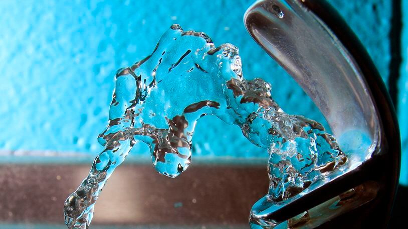 FILE - Water flows from a water fountain in Concord, N.H., on Friday, Jan. 7, 2011. (AP Photo/Jim Cole, File)