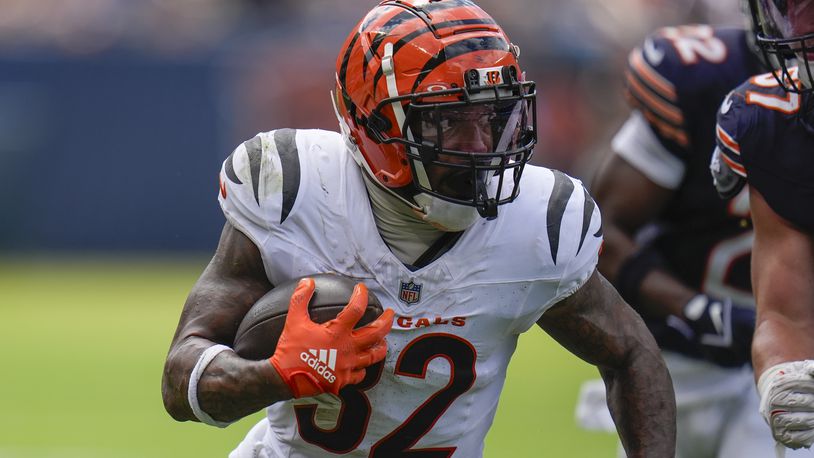 Cincinnati Bengals running back Trayveon Williams (32) runs with the ball during the first half of an NFL preseason football game against the Chicago Bears, Saturday, Aug. 17, 2024, at Soldier Field in Chicago. (AP Photo/Erin Hooley)