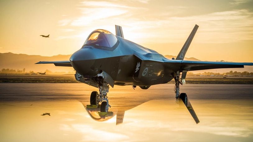 The sun sets behind an Australian F-35A Lighting II at Luke Air Force Base, Ariz., June 27, 2018. The first Australian F-35 arrived at Luke in December 2014. 
While allies and military pilots appear to love the F-35, it has been the focus of persistent criticism for its cost and difficulty in mainintaining.  (U.S. Air Force photo by Staff Sgt. Jensen Stidham) Note: This image was created by placing a reflective surface in front of the the camera lens.