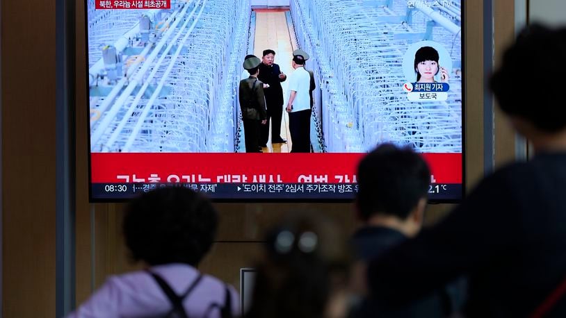 A TV screen shows an image of North Korean leader Kim Jong Un during a news program at the Seoul Railway Station in Seoul, South Korea, Friday, Sept. 13, 2024. The letters read "North Korea, unveiling the uranium enrichment facility for the first time." (AP Photo/Lee Jin-man)