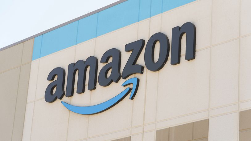 The Amazon logo is seen on the exterior wall of the Amazon OXR1 fulfillment center in Oxnard, Calif., on Wednesday, Aug. 21, 2024. (AP Photo/Damian Dovarganes)