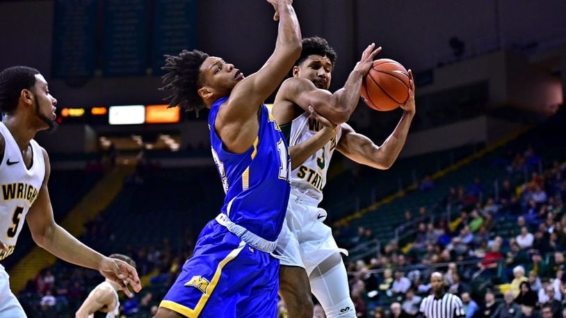 Wright State’s Mark Hughes pulls down a rebound against Morehead State on Tuesday, Dec. 18, 2018, at the Nutter Center. Joseph Craven/CONTRIBUTED