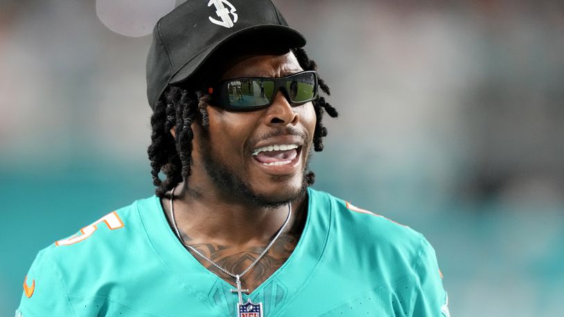 Miami Dolphins cornerback Jalen Ramsey watches from the sideline during the second half of a preseason NFL football game against the Washington Commanders, Saturday, Aug. 17, 2024, in Miami Gardens, Fla. (AP Photo/Wilfredo Lee)