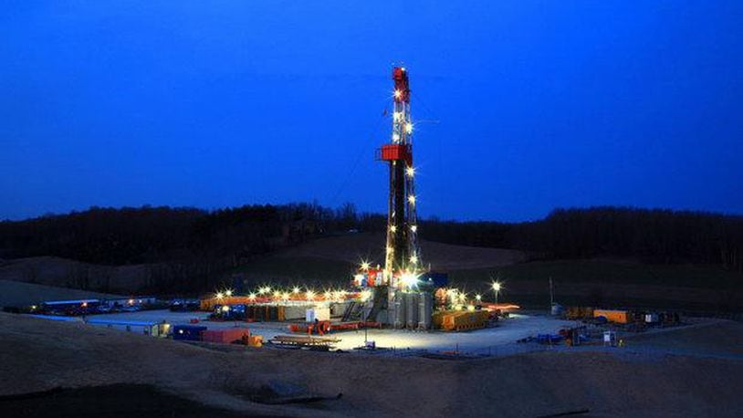 A drilling rig stands lit in Carroll County in 2013 when there was talk of an unstoppable shale “boom” in Ohio. The Plain Dealer