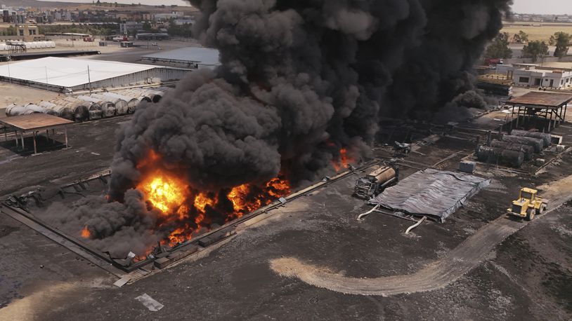An oil refinery burns outside Irbil, Iraq, Thursday, June 13, 2024. (AP Photo/Bilind Tahir/Rudaw)