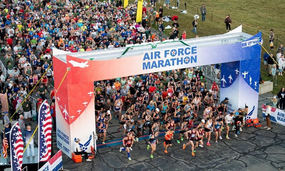 Full and half marathon runners pour through the starting line of the 27th annual Air Force Marathon on Sept. 16, 2023, near the National Museum of the U.S. Air Force, Wright-Patterson Air Force Base. More than 8,500 runners and 1,500 volunteers from all 50 states and 18 countries participated in the event. (U.S. Air Force photo by Jaima Fogg)