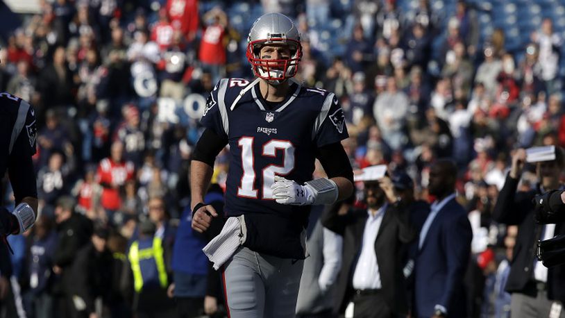 New England Patriots quarterback Tom Brady (12) warms up for a pre