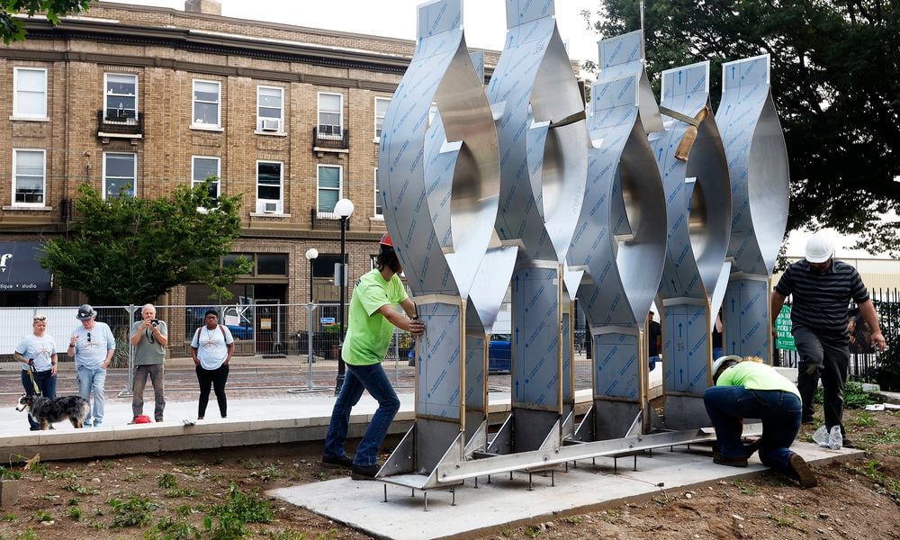 The Seed of Life sculpture for the Oregon District shooting memorial was craned in Thursday, July 25, 2024. MARSHALL GORBY\STAFF