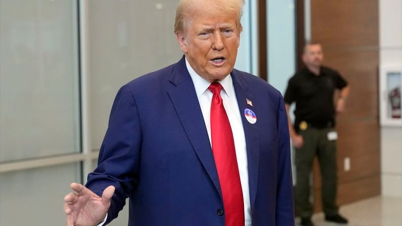 Republican presidential nominee former President Donald Trump talks at the Palm Beach County Supervisor of Elections, Wednesday, Aug. 14, 2024, in West Palm Beach, Fla., after he voted early in person in the Florida primary. (AP Photo/Wilfredo Lee)