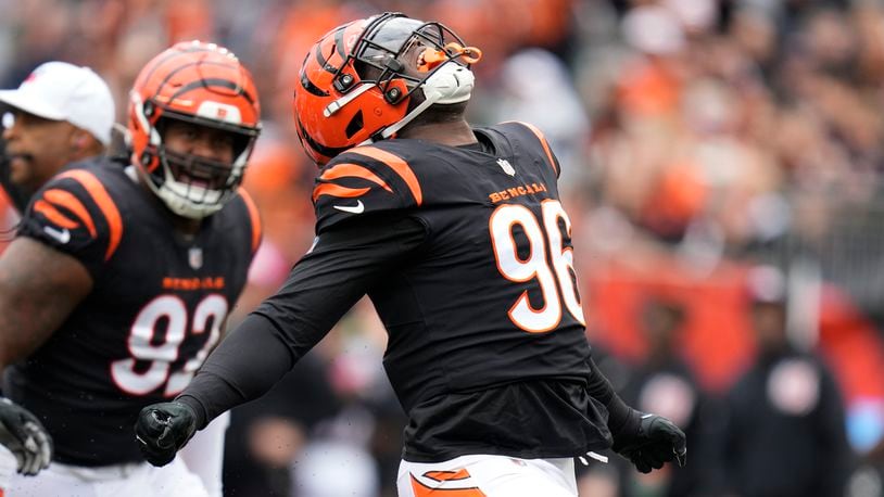 Cincinnati Bengals' Cam Sample (96) celebrates a sack of Seattle Seahawks quarterback Geno Smith during the first half of an NFL football game, Sunday, Oct. 15, 2023, in Cincinnati. (AP Photo/Michael Conroy)