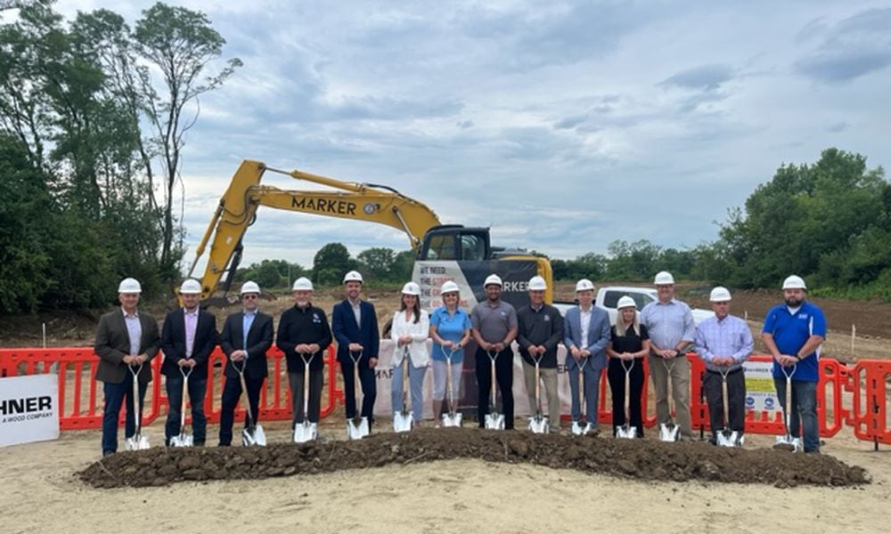 Stakeholders and city officials mark the beginning of construction of a new apartment complex in Huber Heights. CONTRIBUTED