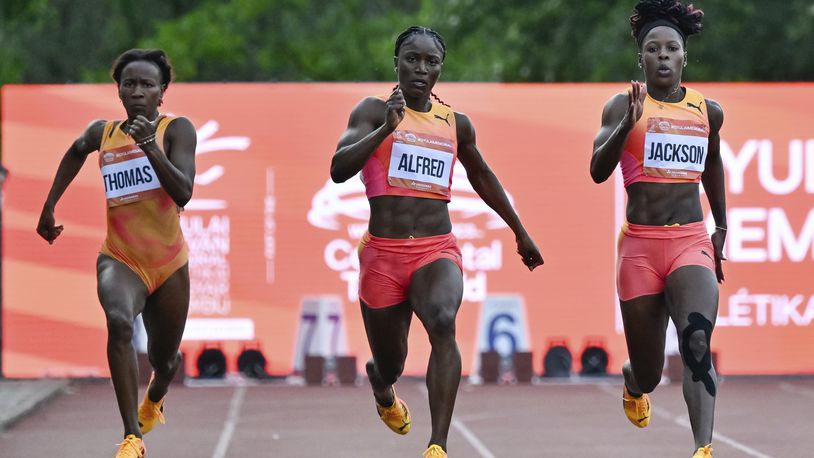 Lanea-Tava Thomas, left, of Jamaica, Julien Alfred, center, of Saint Lucia, and Shericka Jackson, right, of Jamaica, compete in the 200 meter event at the Gyulai Istvan Memorial Track and Field Hungarian Grand Prix in Szekesfehervar, Hungary, Tuesday, July 9, 2024. Julien Alfred, center, of Saint Lucia, won the race. (Tamas Vasvari/MTI via AP)