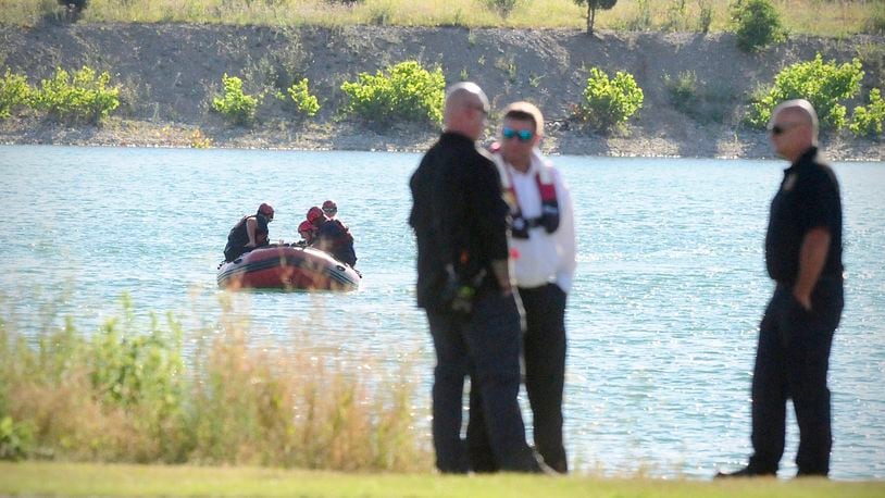 Rescue crews from Dayton, Piqua and Wright Patterson Air Force Base search a lake near Action Sports Monday, July 1, 2024 in Dayton. A swimmer was seen struggling in the water Sunday evening. MARSHALL GORBY\STAFF