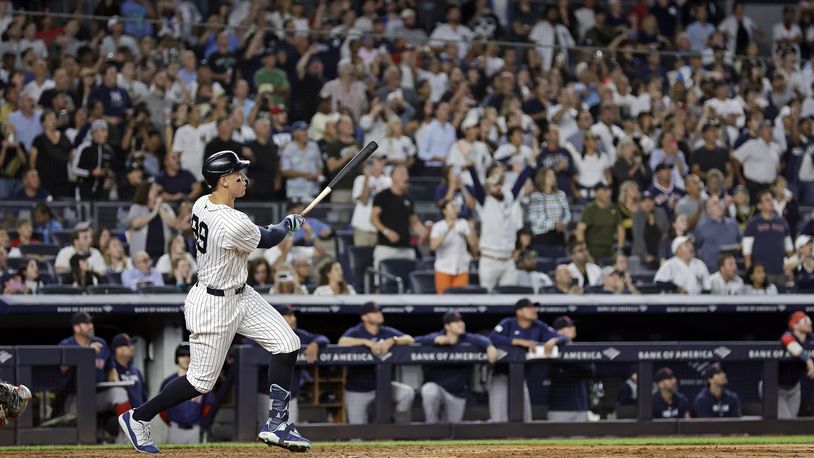 New York Yankees' Aaron Judge hits a grand slam during the seventh inning of a baseball game at bat Friday, Sept. 13, 2024, in New York. (AP Photo/Adam Hunger)