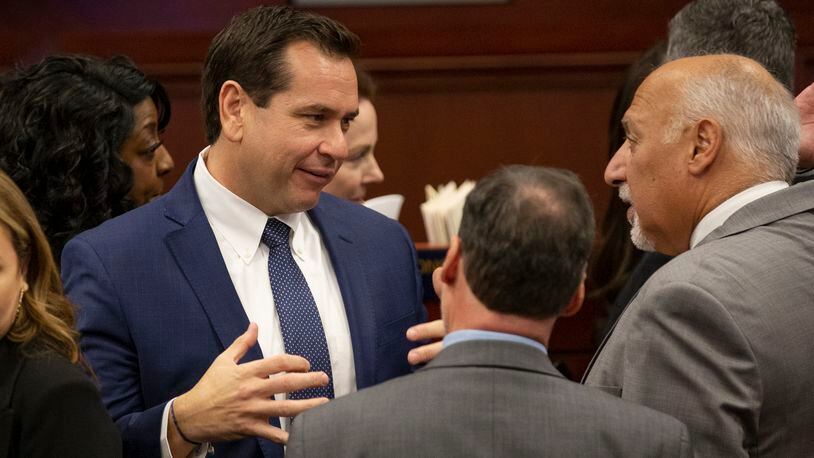 FILE - Nevada Secretary of State Cisco Aguilar, left, talks with Lt. Gov. Stavros Anthony during the opening of the 82nd session of the Nevada Legislature in Carson City, Nev., Feb. 6, 2023. Nevada election officials will start tabulating in-person Election Day votes that morning instead of when polls closed in an attempt to expedite results in the Western swing state known for ballot tabulation that, at times, has stretched close races out for days. (AP Photo/Tom R. Smedes, File)