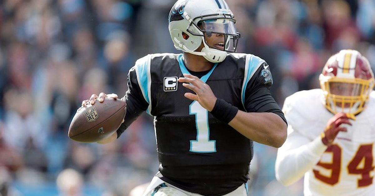 Carolina Panthers' Cam Newton (1) applauds after a play during the