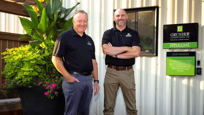 Grunder Landscaping Co. founder and CEO Marty Grunder and company President and Chief Operating Officer Seth Pflum stand outside Grunder Landscaping at 1900 Byers Road in Miamisburg. Founded in 1984, the business recently launched renovations on a Loveland facility ahead of a planned November opening. CONTRIBUTED