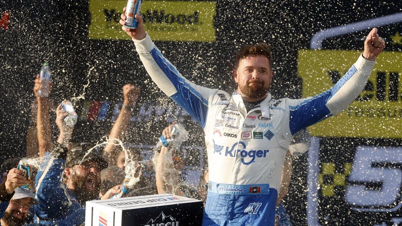 Driver Ricky Stenhouse Jr. celebrates in Victory Lane after a NASCAR Cup Series auto race at Talladega Superspeedway, Sunday, Oct. 6, 2024, in Talladega, Ala. (AP Photo/ Butch Dill)