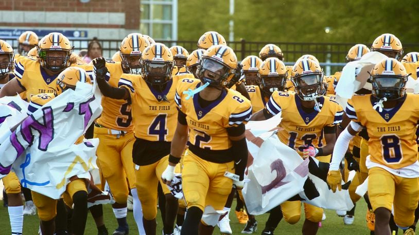 Springfield takes the field before a game against Winton Woods on Friday, Aug. 23, 2024, in Springfield. The Wildcats defeated Miamisburg on Friday night. David Jablonski/Staff