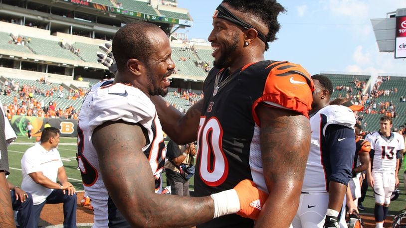 CINCINNATI, OH - SEPTEMBER 25: Von Miller #58 of the Denver Broncos and Cedric Ogbuehi #70 of the Cincinnati Bengals congratulate each other after the game at Paul Brown Stadium on September 25, 2016 in Cincinnati, Ohio. Denver defeated Cincinnati 29-17. (Photo by John Grieshop/Getty Images)