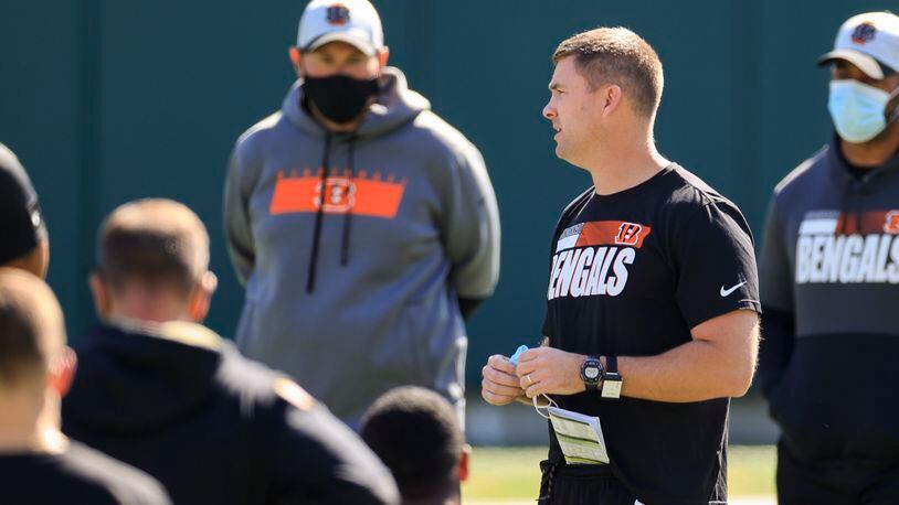 Cincinnati Bengals head coach Zac Taylor speaks to his team during an NFL football rookie minicamp in Cincinnati, Friday, May 14, 2021. (AP Photo/Aaron Doster)