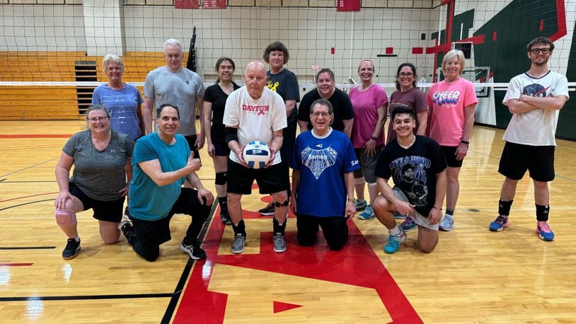 Lou Schweickart (holding volleyball) with his Sinclair Saturday morning volleyball class. CONTRIBUTED