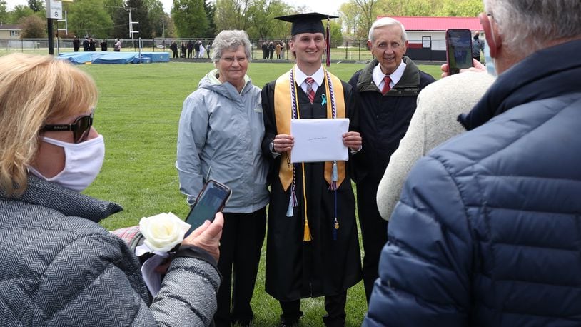 Greenon High School held their 2021 Commencement Ceremony Saturday. Over a 100 graduates, sitting six feet apart and all wearing masks, participated in the ceremony at the school's statium. Greenon is the fist school in the area to hold a 2021 commencement ceremony. BILL LACKEY/STAFF