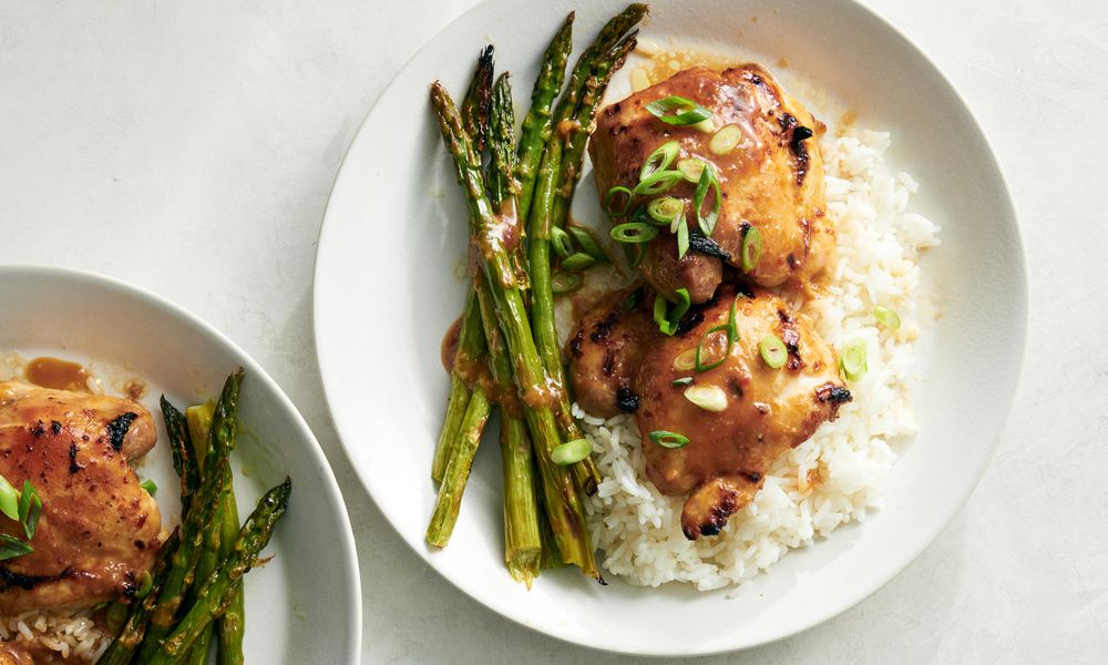 This photo shows Miso-Honey Chicken and Asparagus, a quick and easy sheet-pan meal that is broiled instead of baked, which chars the marinade slightly on the chicken, browns the asparagus for maximum flavor and cuts the cooking time to around 10 minutes. (David Malosh/The New York Times)