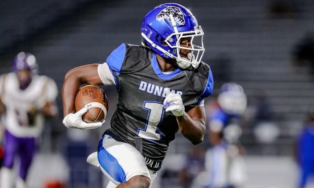 Dunbar High School junior William Wilson runs the ball during their game against Thurgood Marshall on Thursday, Sept. 26 at Dayton Welcome Stadium. The Wolverines won 22-6. Michael Cooper/CONTRIBUTED