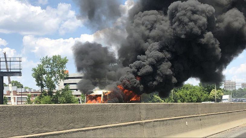 Officials say Interstate 77 southbound at the West Boulevard exit in North Carolina was briefly shut down after a fire engulfed a bus.