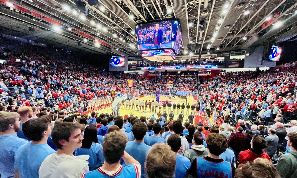 Dayton fans stand for the national anthem before a game against St. Bonaventure on Friday, Feb. 2, 2024, at UD Arena. David Jablonski/Staff