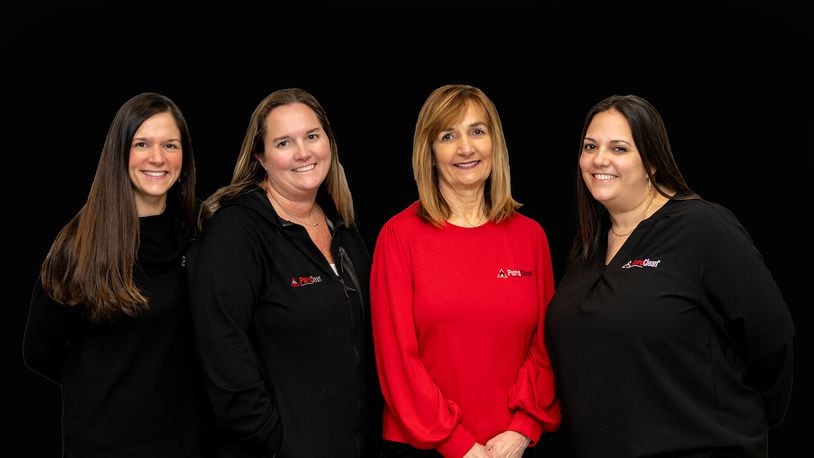 Becky Edgren (in red) is surrounded by her daughters from left, Britni Hurst, Megann Eversole and Lara Harshbarger. Edgren bought a business in 2008 with her three daughters in mind. Though they each had careers, they eventually joined their mom's business full time. CONTRIBUTED