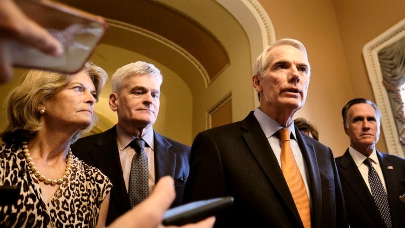 From left: Sens. Lisa Murkowski (R-Alaska), Bill Cassidy (R-La.), Rob Portman (R-Ohio), and Sen. Mitt Romney (R-Utah) speaks to reporters about the infrastructure deal on Wednesday, July 28, 2021, at the Capitol in Washington, The return of a mask mandate on Capitol Hill has prompted a political fight in Congress, where Democrats from low-risk areas are complying while Republicans protest fiercely. (T.J. Kirkpatrick/The New York Times)