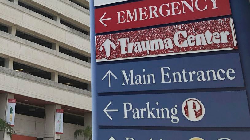 FILE - A sign is displayed outside a hospital in Miami, on July 9, 2020. (AP Photo/Wilfredo Lee, File)