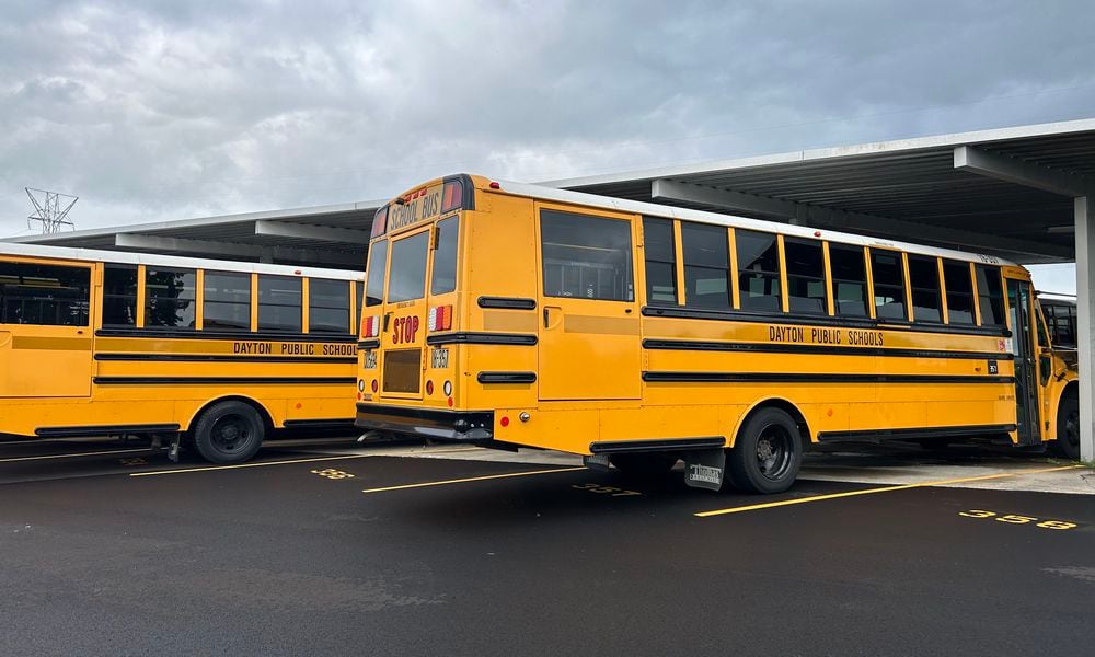 Buses in the Dayton Public Schools Transportation Center lot on James H. McGee Blvd. Eileen McClory/ staff