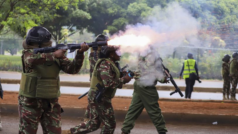 Police officers fire tear gas canisters during a protest over proposed tax hikes in a finance bill that is due to be tabled in parliament in Nairobi, Kenya, Thursday, June 20, 2024. (AP Photo/ Andrew Kasuku)