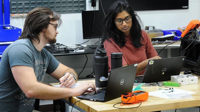 Aeroseal employees, Bobby Phillips, left, and Kruthi Anumandla, run tests on new products. MARSHALL GORBY\STAFF